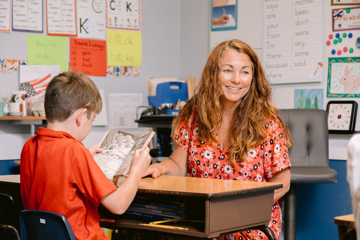 Nancy Bostock listening to a student in class