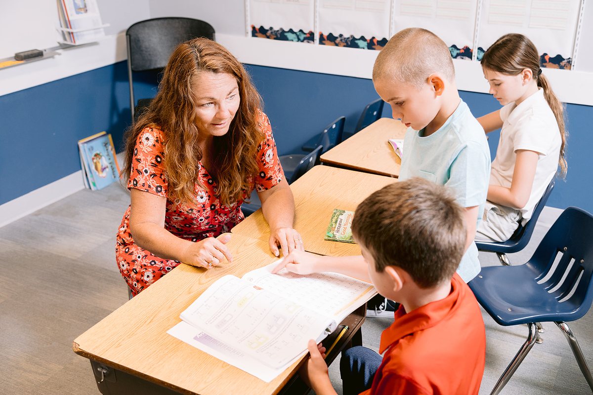 Nancy Bostock working with students on classwork