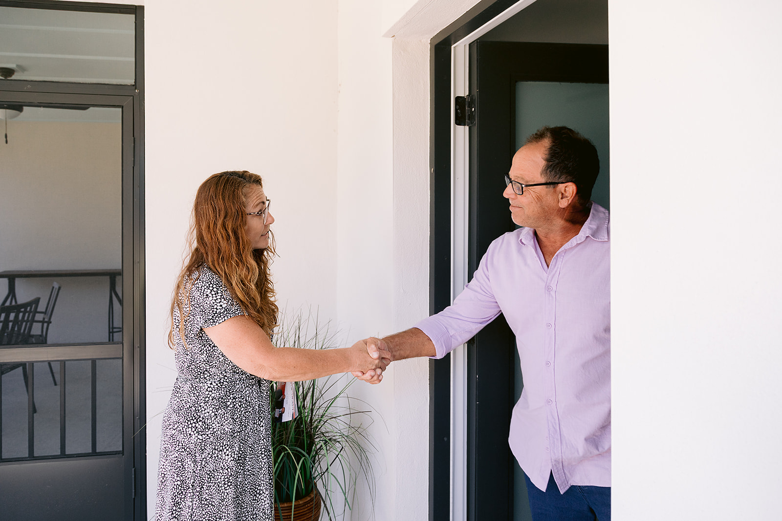 Nancy Bostock meeting a District 6 resident at his front door