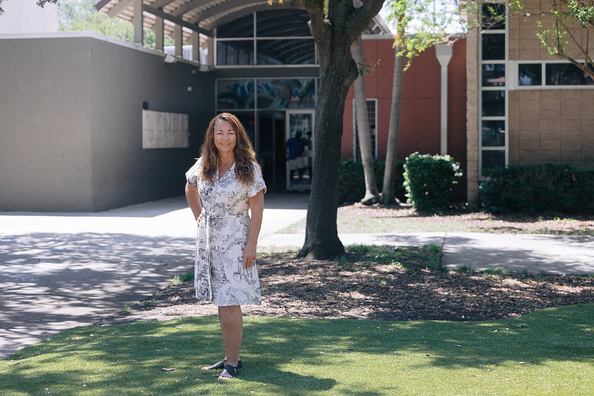 Nancy Bostock in front of a Pinellas County school